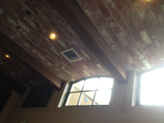 Brick-lined ceiling with exposed beams