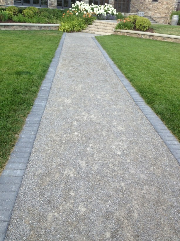 Simple walkway of gravel with grey brick border