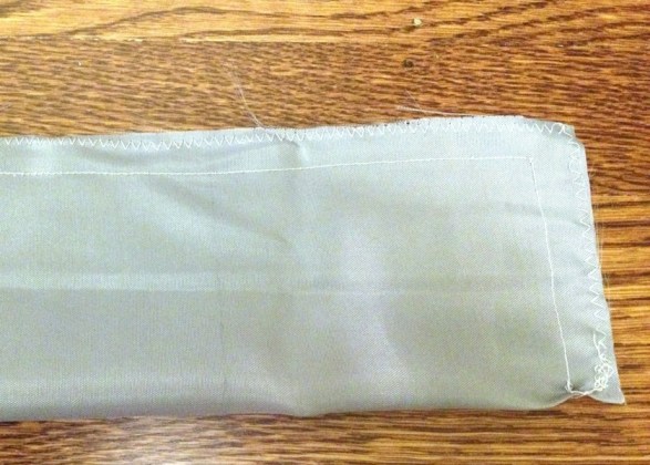 Sew the strap with a straight stitch and a zig-zag stitch to finish the edges.