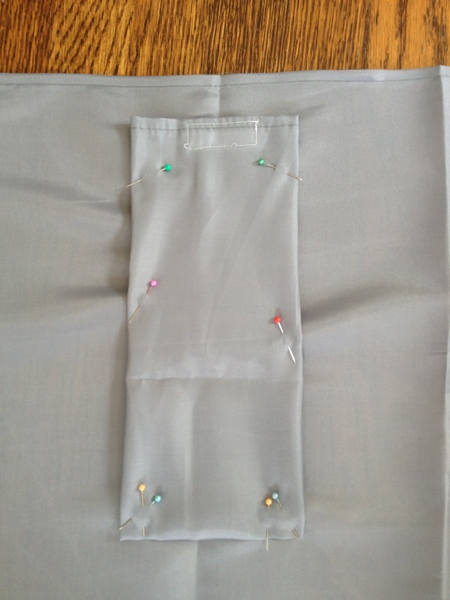 With the velcro matched up, sew the cutlery pouch to the main bag.