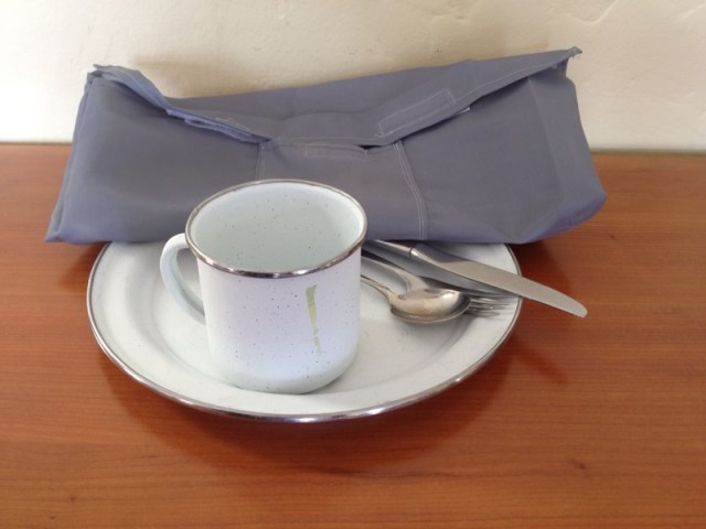 Pouch for holding camping plate, cup, and utensils, made from an inexpensive shower curtain by Jewels at Home.