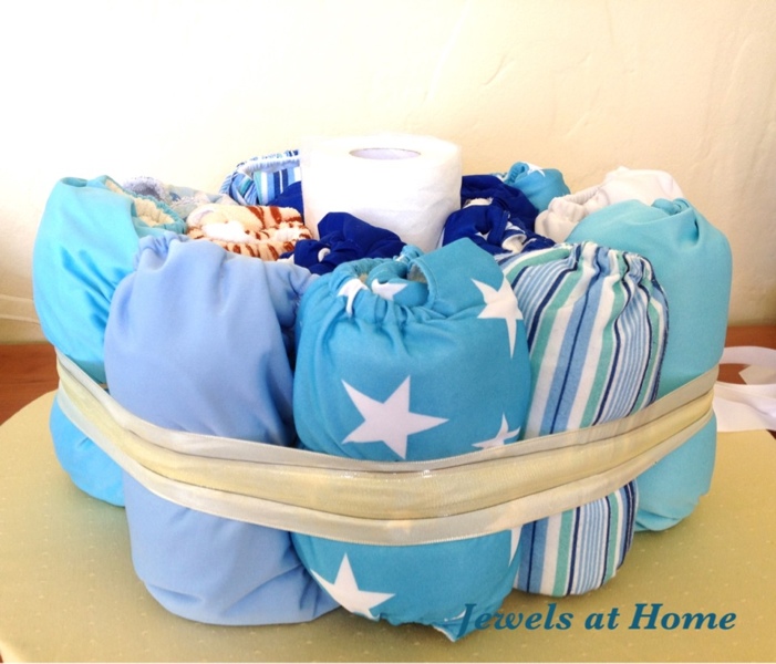 Making a diaper cake with cloth diapers by Jewels at Home.