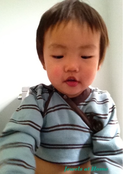 Potty/ diapering trick: snap the tails of a onesie over the baby's shoulder to keep them clean.  From Jewels at Home.