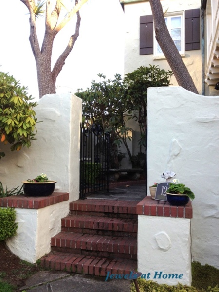 A new house color and some flowers at the front door make this place feel like home.