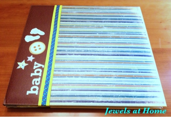 Decorate a scrapbook for a baby shower.  From Jewels at Home.