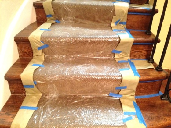 20120823-213845.jpgTo paint stair risers after a runner is installed, you'll have to tape off the runner thoroughly.