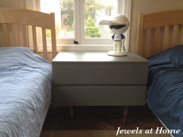 Mid-Century nightstand painted in Benjamin Moore Amherst Gray with reverse "dipped" legs. From Jewels at Home. Mid-Century nightstand painted in Benjamin Moore Amherst Gray with reverse "dipped" legs. From Jewels at Home.