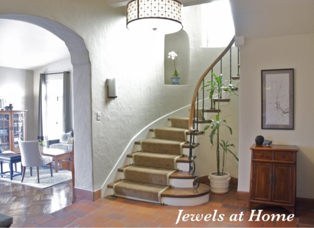 A classic stairway with a new look. Walls are Manchester Tan from Benjamin Moore. From Jewels at Home.