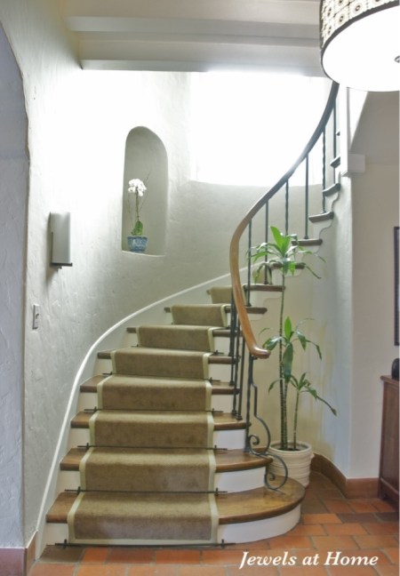 A classic stairway with a new look. Walls are Manchester Tan from Benjamin Moore. From Jewels at Home.