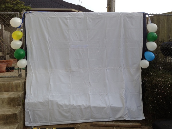 Canvas drop cloth used as a movie screen.  Via Jewels at Home.