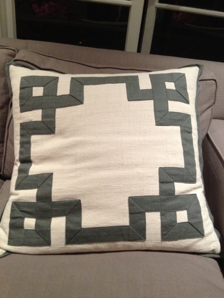 Ribbon-bordered throw pillow.  Spotted by Jewels at Home.