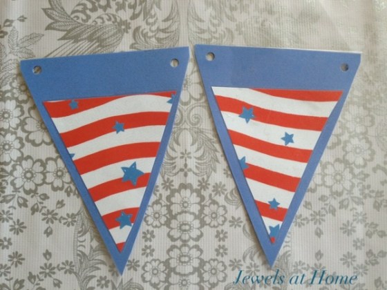 Making pennants for a birthday banner.  Cover the paper with clear contact paper, so decorations can be switched out according to the party's theme.  Jewels at Home.