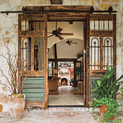 Salvaged doors installed to slide on a rail.  Shown at Lavender and Lilies.