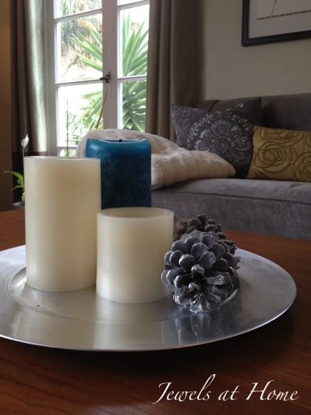 Spray some pinecones in silver paint to brighten up your holiday decor.  {Jewels at Home}