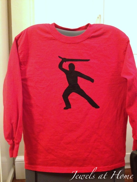 Stencil your own T-shirts with contact paper and fabric paint. Heat set the paint with an iron.  The ideas are endless.  These are for a boy's Ninjago birthday party.  {Jewels at Home}