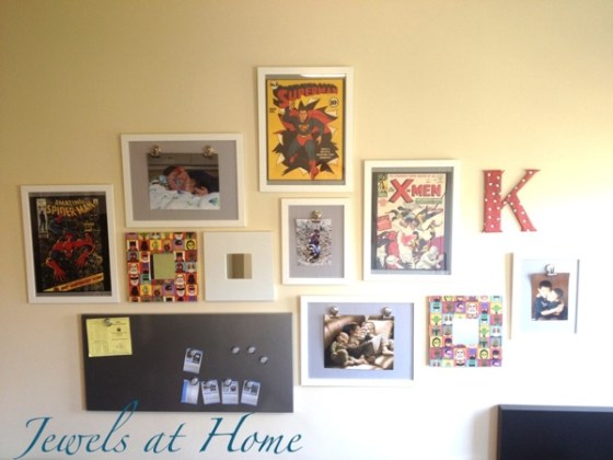 Vintage comic-themed gallery wall with DIY mirror frame, wall initials, and gallery clip frames.  Includes link to a source for these beautiful vintage comic covers.  {Jewels at Home}