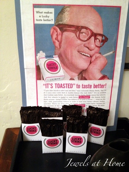 Mad Men party.  Party favors: Lucky Strike boxes filled with mint chocolates and displayed under a vintage ad | Jewels at Home