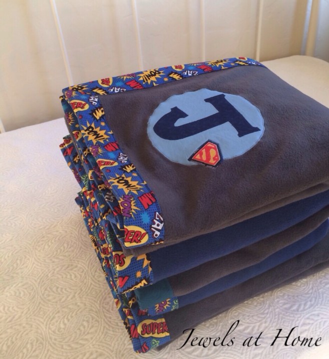 Superhero-themed monogrammed fleece blankets for a boys' sleepover party | Jewels at Home